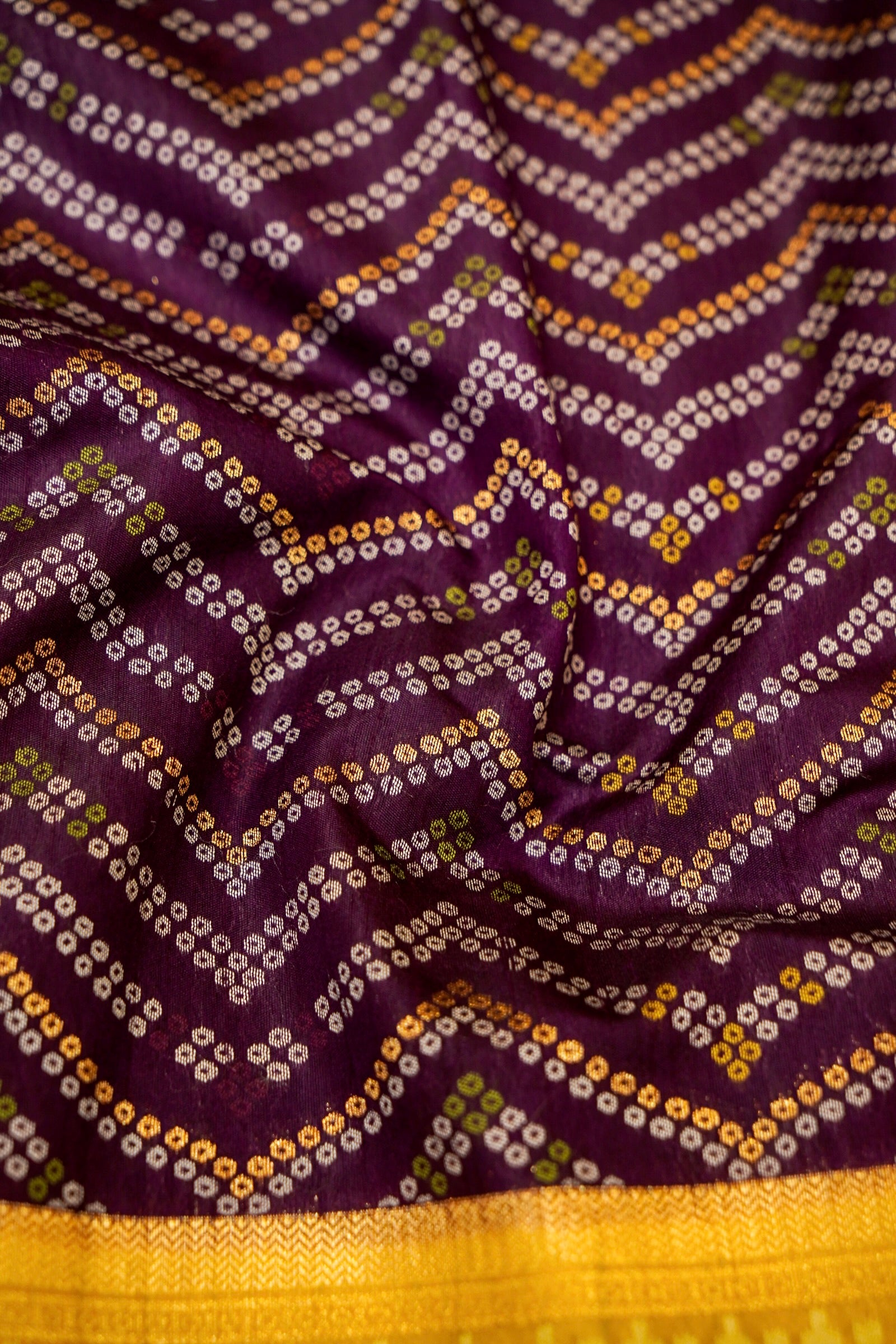 Deep Plum Ikkat Patola Silk Saree with Mustard Border and Stitched Blouse