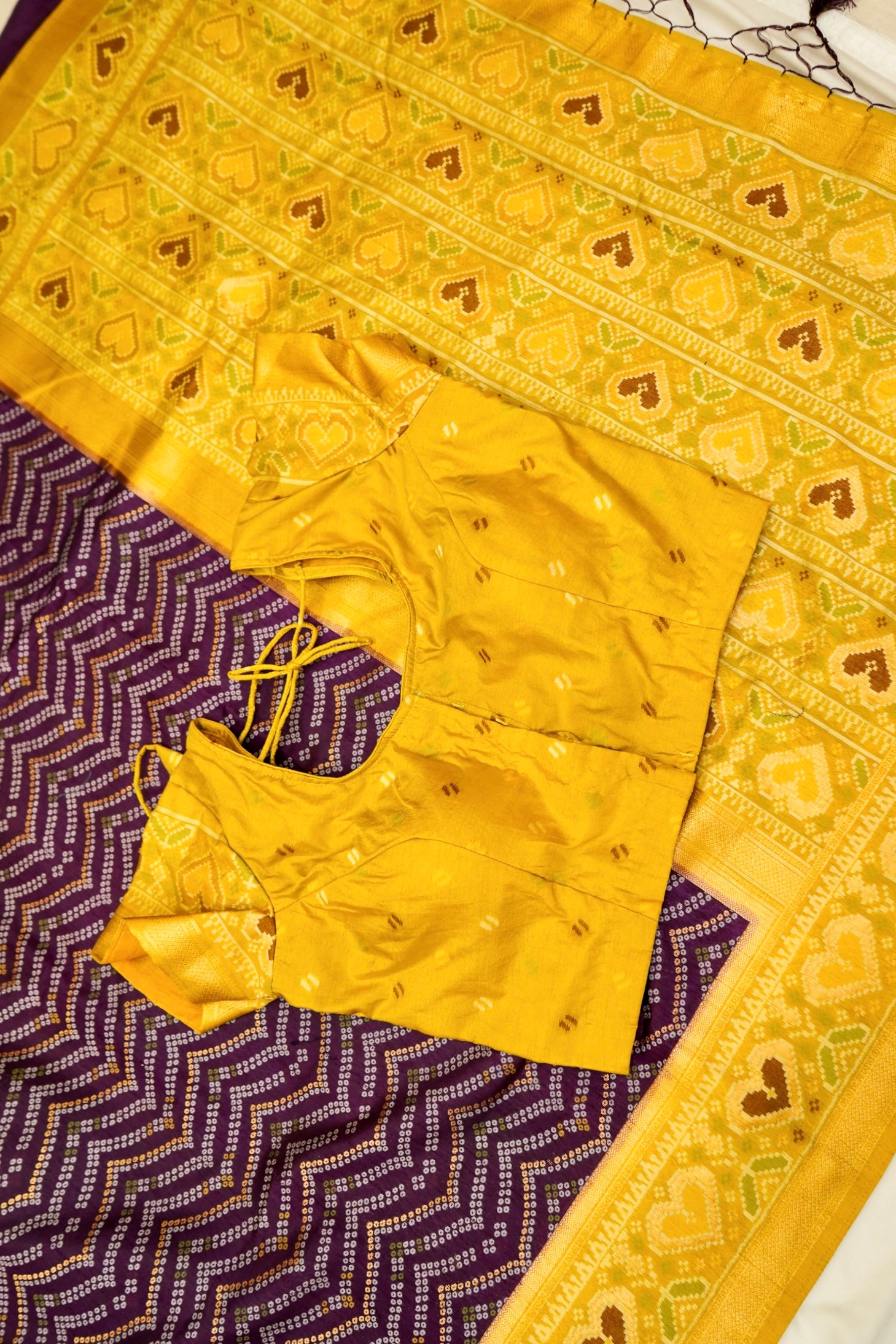 Deep Plum Ikkat Patola Silk Saree with Mustard Border and Stitched Blouse