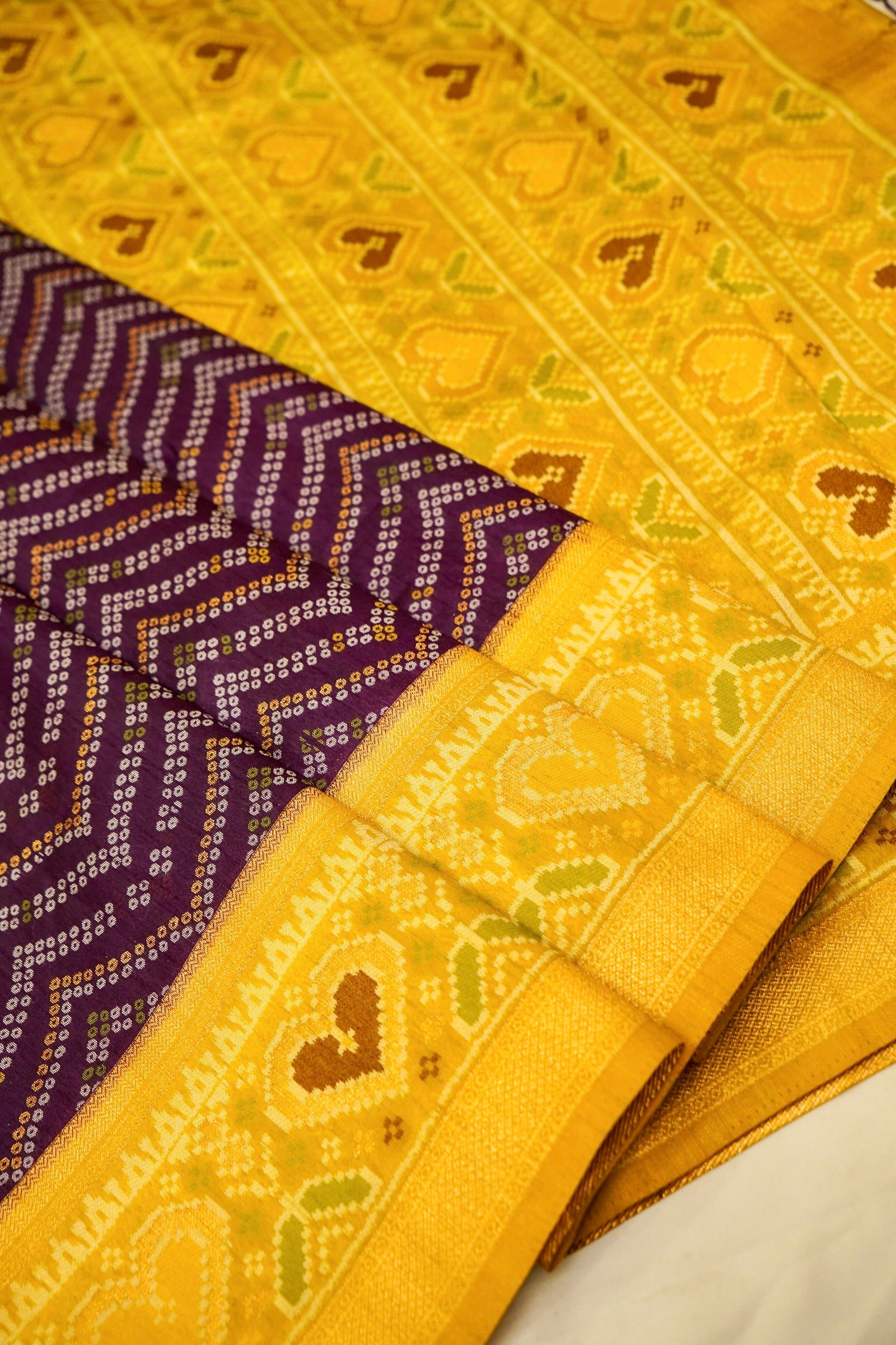 Deep Plum Ikkat Patola Silk Saree with Mustard Border and Stitched Blouse